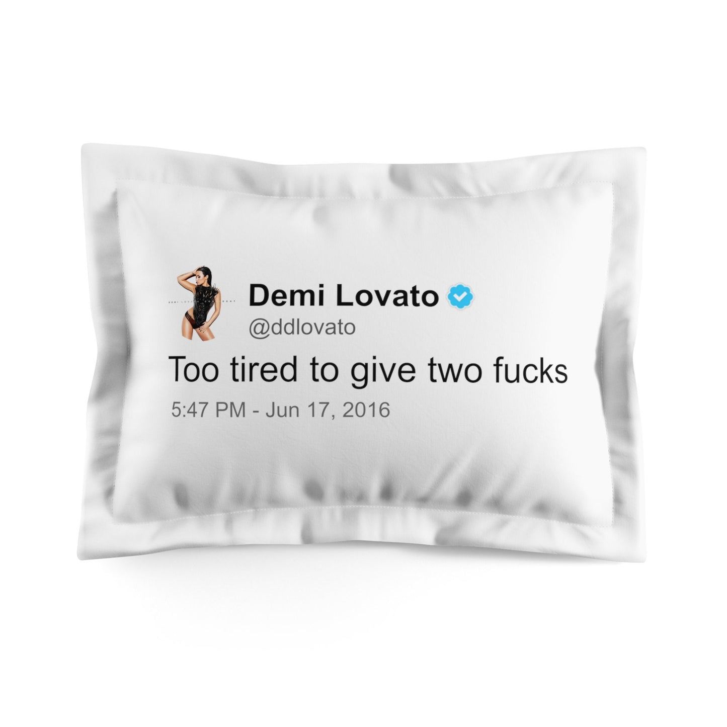 A preview of a white Demi Lovato pillowcase featuring a tweet telling us just how tired she is. The text is displayed in a bold, eye-catching font against the pillowcase's crisp, white background, capturing a moment of candidness and relatable sentiment from the artist.